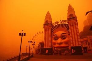 Sydney's Luna Park is bathed in an orange glow as a giant cloud of red dust blows through New South Wales. Photo / Getty Images Sydney's Luna Park is bathed in an orange glow as a giant cloud of red dust blows through New South Wales. Photo / Getty Images
