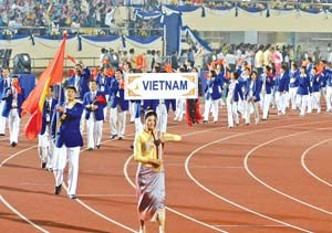 The Vietnamese contingent during the march past at the opening ceremony of the 25th SEA Games in Vientiane Wednesday (Photo: SGGP) The Vietnamese contingent during the march past at the opening ceremony of the 25th SEA Games in Vientiane Wednesday (Photo: SGGP)