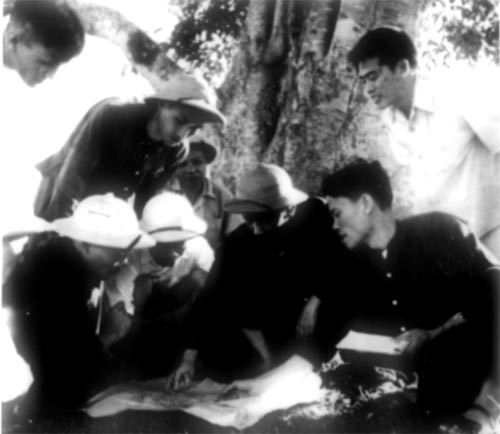 In this undated file photo, President Ho Chi Minh (3rd, R) discusses plans for the Bac-Hung-Hai irrigational project in northern Vietnam when he made a working trip to the site.