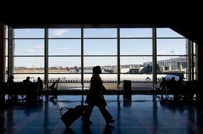 A passenger walks toward a security checkpoint at Ronald Reagan Washington National Airport in Arlington, Virginia, just outside Washington, DC, on
