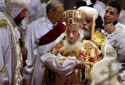 Pope Shenouda III, the head of Egypt's Coptic Orthodox church, leads prayers at the Coptic Cathedral in Cairo, Egypt, early Thursday, Jan. 7, 2010. Pope Shenouda III, the head of Egypt's Coptic Orthodox church, leads prayers at the Coptic Cathedral in Cairo, Egypt, early Thursday, Jan. 7, 2010.
