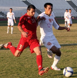 Vietnam's Truong Dinh Luat (R) competes with Lebanon's Hamze Abboud during their Group D Asian Cup 2011 qualifying match on January 6, 2010 in Sidon, Lebanon. AFP PHOTO