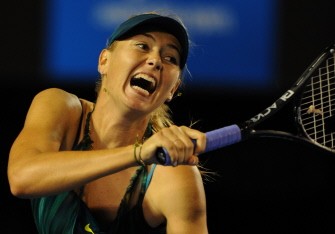 Maria Sharapova plays a return stroke during her women's singles match against Maria Kirilenko on the first day of play at the Australian Open in Melbourne on January 18, 2010 (AFP photo)