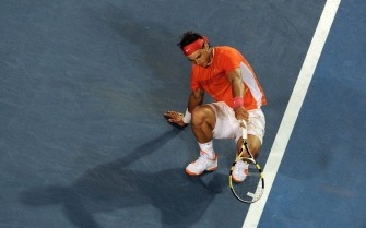 Nadal lifts himself up off the court after falling during his men's singles quarter-final match against British opponent Andy Murray on day nine at the Australian Open tennis tournament in Melbourne on January 26, 2010. AFP photo Nadal lifts himself up off the court after falling during his men's singles quarter-final match against British opponent Andy Murray on day nine at the Australian Open tennis tournament in Melbourne on January 26, 2010. AFP photo