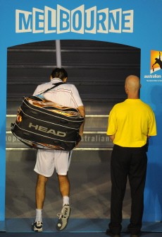 Marin Cilic (L) leaves the court after defeat in his men's singles semi-final match against British opponent Andy Murray at the Australian Open tennis tournament in Melbourne on January 28, 2010. AFP PHOTO