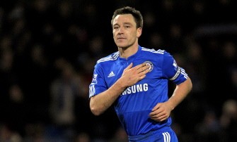 John Terry touches his Chelsea badge as he leaves the pitch after the final whistle in the English Premier League football match between Burnley and Chelsea on January 30, 2010. AFP PHOTO John Terry touches his Chelsea badge as he leaves the pitch after the final whistle in the English Premier League football match between Burnley and Chelsea on January 30, 2010. AFP PHOTO