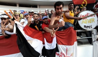 Egyptian fans cheer to celebrate Egyptian victory during the final match between Egypt and Ghana at the African Cup of Nations football championships CAN2010 at November 11 stadium in Luanda on January 31,2010. AFP PHOTO Egyptian fans cheer to celebrate Egyptian victory during the final match between Egypt and Ghana at the African Cup of Nations football championships CAN2010 at November 11 stadium in Luanda on January 31,2010. AFP PHOTO