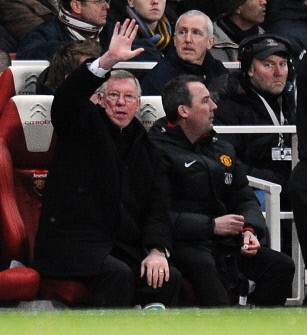 Sir Alex Ferguson waves to the fans during their English Premier League football match against Arsenal at the Emirates in London on January 31, 2010. AFP PHOTO Sir Alex Ferguson waves to the fans during their English Premier League football match against Arsenal at the Emirates in London on January 31, 2010. AFP PHOTO