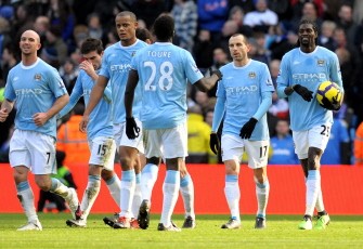 Adebayor (R) reacts after scoring the opening goal during the English Premier League football match against Portsmouth at The City of Manchester stadium in Manchester on January 31, 2010. AFP PHOTO Adebayor (R) reacts after scoring the opening goal during the English Premier League football match against Portsmouth at The City of Manchester stadium in Manchester on January 31, 2010. AFP PHOTO