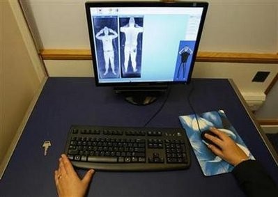 A security officer examines a computer screen showing a scan from a RapiScan full-body scanner, being trialled by Manchester Airport, during a photocall at the airport, in Manchester, northern England January 7 A security officer examines a computer screen showing a scan from a RapiScan full-body scanner, being trialled by Manchester Airport, during a photocall at the airport, in Manchester, northern England January 7