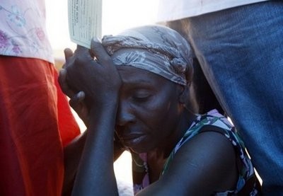 A Haitian refugee rests at the National Stadium in Port-au-Prince where the World Health Organization is providing Dyptheria and Tetnus vaccinations. AFP photo A Haitian refugee rests at the National Stadium in Port-au-Prince where the World Health Organization is providing Dyptheria and Tetnus vaccinations. AFP photo