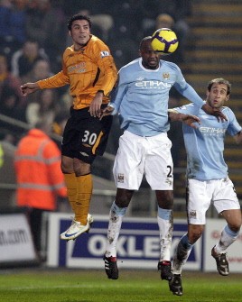 Hull City's Amr Zaki (L) vies with Manchester City's Patrick Vieira (2nd L) during the English Premier League football match between Hull City and Manchester City at the KC Stadium, Kingston on February 6, 2010. AFP PHOTO Hull City's Amr Zaki (L) vies with Manchester City's Patrick Vieira (2nd L) during the English Premier League football match between Hull City and Manchester City at the KC Stadium, Kingston on February 6, 2010. AFP PHOTO