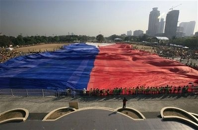 Supporters of presidential candidate Eddie Villanueva unfurl a 2-hectare Philippine flag to kick off his campaign for the May 10, 2010 national elections Tuesday, Feb. 9, 2010 at Manila's Rizal Park. Supporters of presidential candidate Eddie Villanueva unfurl a 2-hectare Philippine flag to kick off his campaign for the May 10, 2010 national elections Tuesday, Feb. 9, 2010 at Manila's Rizal Park.
