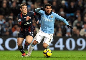 Carlos Tevez (R) vies with Bolton Wanderers midfielder Jack Wilshire during their English Premier League football on February 9, 2010. AFP PHOTO Carlos Tevez (R) vies with Bolton Wanderers midfielder Jack Wilshire during their English Premier League football on February 9, 2010. AFP PHOTO