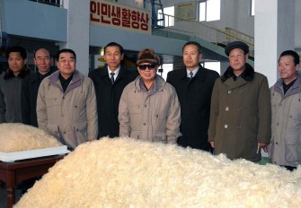 This undated picture, released from North Korea's official Korean Central News Agency on February 10, 2010 shows North Korean leader Kim Jong-Il (C) posing during a visit in front of a large bale of vinalon cotton, chemical fibers, at the February 8 vinalon complex in South Hamgyong province in North Korea This undated picture, released from North Korea's official Korean Central News Agency on February 10, 2010 shows North Korean leader Kim Jong-Il (C) posing during a visit in front of a large bale of vinalon cotton, chemical fibers, at the February 8 vinalon complex in South Hamgyong province in North Korea