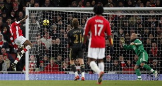 Arsenal's French player Abou Diaby (L) scores the opening goal of the English Premier League football match between Arsenal and Liverpool on February 10, 2010. AFP PHOTO Arsenal's French player Abou Diaby (L) scores the opening goal of the English Premier League football match between Arsenal and Liverpool on February 10, 2010. AFP PHOTO