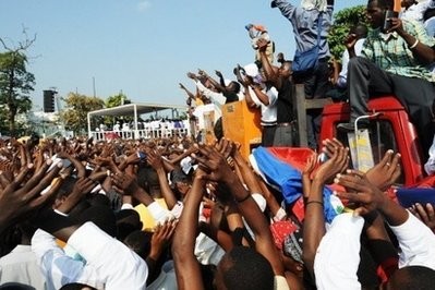 A large crowd of survivors of Haiti's earthquake raise their arms in prayer during an outdoor mass in downtown Port-Au-Prince A large crowd of survivors of Haiti's earthquake raise their arms in prayer during an outdoor mass in downtown Port-Au-Prince