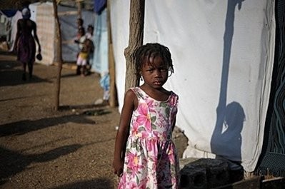 A Haitian girl stands next to tents at a camp in Port-au-Prince set up for people displaced from their homes (AFP photo) A Haitian girl stands next to tents at a camp in Port-au-Prince set up for people displaced from their homes (AFP photo)