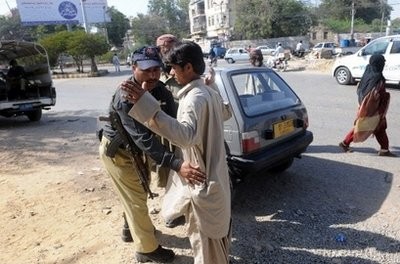 A Pakistani policeman searches a pedestrian at a check point in Karachi on February 16, 2010. AFP photo A Pakistani policeman searches a pedestrian at a check point in Karachi on February 16, 2010. AFP photo
