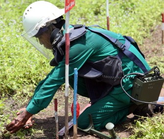 In a file picture taken on July 25, 2007 a Cambodian deminer clears landmines from a field in the Samlot district in Battambang province, some 290kms northwest of Phnom Penh. AFP PHOTO In a file picture taken on July 25, 2007 a Cambodian deminer clears landmines from a field in the Samlot district in Battambang province, some 290kms northwest of Phnom Penh. AFP PHOTO
