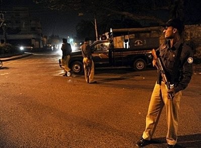 Pakistani policemen keep vigil at a security checkpoint in Karachi. Pakistani policemen keep vigil at a security checkpoint in Karachi.