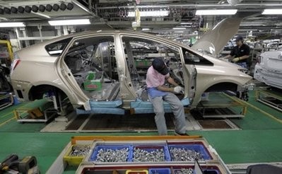 (AFP file) A Toyota Motors factory worker assembles parts on a Prius hybrid vehicle at the Japanese auto giant's Toyota City facility. (AFP file) A Toyota Motors factory worker assembles parts on a Prius hybrid vehicle at the Japanese auto giant's Toyota City facility.