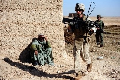 A US Marine passes an Afghan man during a patrol on the outskirts of Marjah in Afghanistan's central Helmand province. (AFP file) A US Marine passes an Afghan man during a patrol on the outskirts of Marjah in Afghanistan's central Helmand province. (AFP file)