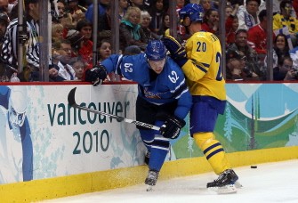 Jarkko Immonen #62 of Finland is checked by Henrik Sedin #20 of Sweden during the ice hockey men's preliminary game between Sweden and Finland on day 10 of the Vancouver 2010 Winter Olympics at Canada Hockey Place on February 21, 2010 in Vancouver, Canada. AFP photo Jarkko Immonen #62 of Finland is checked by Henrik Sedin #20 of Sweden during the ice hockey men's preliminary game between Sweden and Finland on day 10 of the Vancouver 2010 Winter Olympics at Canada Hockey Place on February 21, 2010 in Vancouver, Canada. AFP photo