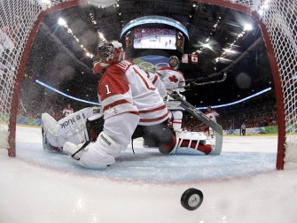Canadian goalkeeper Roberto Luongo (1) misses the puck during the Men's Ice Hockey Quarter-finals Canada against Russia in Vancouver, Canada on February 24, 2010. Canada won 7-3. AFP PHOTO Canadian goalkeeper Roberto Luongo (1) misses the puck during the Men's Ice Hockey Quarter-finals Canada against Russia in Vancouver, Canada on February 24, 2010. Canada won 7-3. AFP PHOTO
