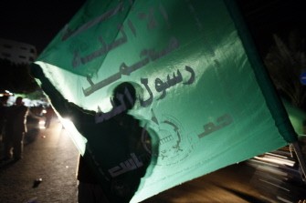 A Hamas supporter waves the movement's flag during a rally in Gaza City against Israel's plan to restore two flashpoint Jewish holy sites in the occupied West Bank on February 24, 2010. AFP photo A Hamas supporter waves the movement's flag during a rally in Gaza City against Israel's plan to restore two flashpoint Jewish holy sites in the occupied West Bank on February 24, 2010. AFP photo