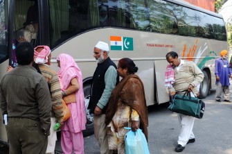 Pakistani travellers board their bus after exiting the Indian immigration and customs check at the Wagah Border India on February 24, 2010. AFP PHOTO Pakistani travellers board their bus after exiting the Indian immigration and customs check at the Wagah Border India on February 24, 2010. AFP PHOTO