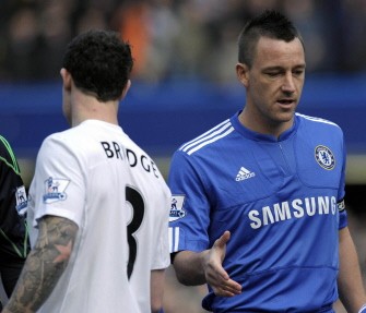 Terry (R) fails to get a hand shake from Manchester City's Wayne Bridge (L) during their Premier League football match at Stamford Bridge on February 27, 2010. AFP PHOTO Terry (R) fails to get a hand shake from Manchester City's Wayne Bridge (L) during their Premier League football match at Stamford Bridge on February 27, 2010. AFP PHOTO