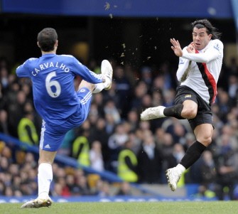 Chelsea's Ricardo Carvalho (L) challenges Manchester City's Carlos Tevez during their Premier League football match at Stamford Bridge on February 27, 2010. AFP PHOTO Chelsea's Ricardo Carvalho (L) challenges Manchester City's Carlos Tevez during their Premier League football match at Stamford Bridge on February 27, 2010. AFP PHOTO