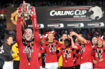 Wayne Rooney (Foreground) celebrates with the trophy after his team beat Aston Villa 2-1 to win the 2010 Carling Cup Final at Wembley on February 28, 2010. AFP PHOTO Wayne Rooney (Foreground) celebrates with the trophy after his team beat Aston Villa 2-1 to win the 2010 Carling Cup Final at Wembley on February 28, 2010. AFP PHOTO
