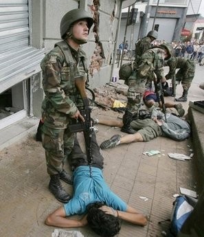 Chilean soldiers arrest alleged looters in Concepcion, Chile. AFP photo Chilean soldiers arrest alleged looters in Concepcion, Chile. AFP photo