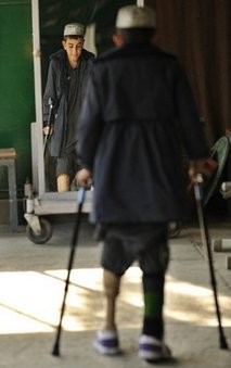 An Afghan boy practices walking with prosthesis at an International Committee of the Red Cross (ICRC) An Afghan boy practices walking with prosthesis at an International Committee of the Red Cross (ICRC)