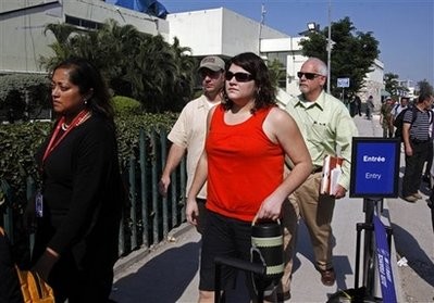 Charisa Coulter, second from right, of Meridian, Idaho, one of two US Baptist missionaries held on kidnapping charges in Haiti, arrives to the airport. Charisa Coulter, second from right, of Meridian, Idaho, one of two US Baptist missionaries held on kidnapping charges in Haiti, arrives to the airport.