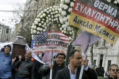 Striking municipal workers march with a coffin and wreaths in central Athens March 10. Striking municipal workers march with a coffin and wreaths in central Athens March 10.