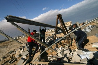 Palestinians inspect damages following Israeli air strikes in the southern Gaza. AFP PHOTO Palestinians inspect damages following Israeli air strikes in the southern Gaza. AFP PHOTO