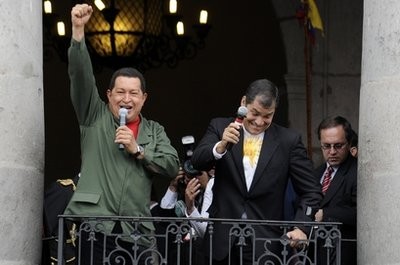 Ecuador's President Rafael Correa, right, gestures while Venezuela's President Hugo Chavez holds up his fist at a balcony of the government palace in Quito, Friday, March 26, 2010. Ecuador's President Rafael Correa, right, gestures while Venezuela's President Hugo Chavez holds up his fist at a balcony of the government palace in Quito, Friday, March 26, 2010.