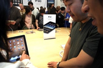 People at the SoHo New York Apple store try out Apple Inc's new iPad on April 3, 2010 in New York City. AFP photo People at the SoHo New York Apple store try out Apple Inc's new iPad on April 3, 2010 in New York City. AFP photo