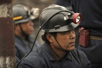 Mine workers and rescuers wait to go down the entrance to the Wangjialing coal mine that flooded eight days ago in northern China's Shanxi province. (AFP/File) Mine workers and rescuers wait to go down the entrance to the Wangjialing coal mine that flooded eight days ago in northern China's Shanxi province. (AFP/File)