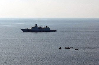 A handout photo made available on April 4, 2010 by the EU Navfor Somalia shows the EU Navfor warship HNLMS Tromp (L) as pirate boats on April 2 try to make on approach on it. AFP photo A handout photo made available on April 4, 2010 by the EU Navfor Somalia shows the EU Navfor warship HNLMS Tromp (L) as pirate boats on April 2 try to make on approach on it. AFP photo