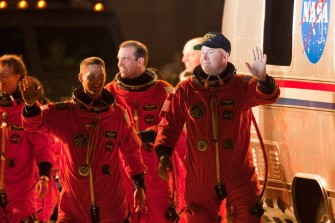 NASA's STS-131 astronauts led by Commander Alan Poindexter (R) wave as they walk out of the operations and checkout building at Kennedy Space Center on April 5, 2010. AFP Photo NASA's STS-131 astronauts led by Commander Alan Poindexter (R) wave as they walk out of the operations and checkout building at Kennedy Space Center on April 5, 2010. AFP Photo