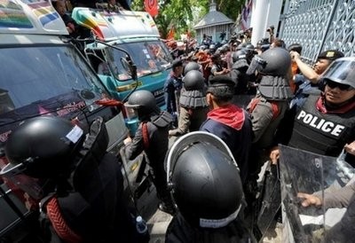 Red Shirt supporters of ousted premier Thaksin Shinawatra clash with riot-police during an anti-government protest at the parliament in Bangkok. Red Shirt supporters of ousted premier Thaksin Shinawatra clash with riot-police during an anti-government protest at the parliament in Bangkok.