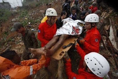 Firefighters rescue an injured man after a landslide in the Morro dos Prazeres area of the Santa Teresa neighborhood in Rio de Janeiro Firefighters rescue an injured man after a landslide in the Morro dos Prazeres area of the Santa Teresa neighborhood in Rio de Janeiro