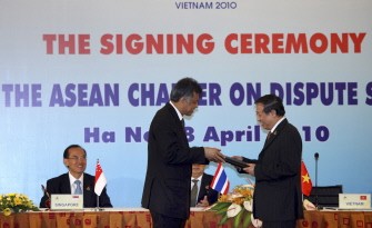 Vietnamese Foreign Minister Pham Gia Khiem (R) hands the protocol to the ASEAN charter on dispute settlement mechanisms signed by all ASEAN foreign ministers to Surin Pitsuwan (2nd L), the ASEAN secretary-general, during a signing ceremony at the 16th ASEAN Summit in Hanoi on April 8, 2010. AFP photo Vietnamese Foreign Minister Pham Gia Khiem (R) hands the protocol to the ASEAN charter on dispute settlement mechanisms signed by all ASEAN foreign ministers to Surin Pitsuwan (2nd L), the ASEAN secretary-general, during a signing ceremony at the 16th ASEAN Summit in Hanoi on April 8, 2010. AFP photo