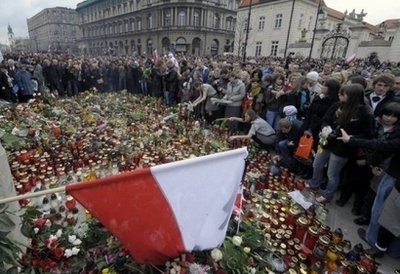 People gather in front of the presidential palace in Warsaw. Investigators scrambled on Sunday to determine if pilot error was to blame for the fiery crash of a Soviet-era airliner that killed Polish President Lech Kaczynski and 96 others People gather in front of the presidential palace in Warsaw. Investigators scrambled on Sunday to determine if pilot error was to blame for the fiery crash of a Soviet-era airliner that killed Polish President Lech Kaczynski and 96 others
