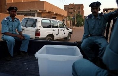 Sudanese police officers guard a ballot box being dispatched to a polling station in Khartoum. Sudanese police officers guard a ballot box being dispatched to a polling station in Khartoum.
