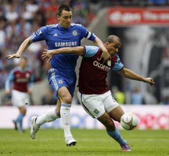 John Terry (L) vies with Aston Villa's English striker Gabriel Agbonlahor (R) during the FA Cup semi-final football match at Wembley Stadium, London, on April 10, 2010. AFP PHOTO John Terry (L) vies with Aston Villa's English striker Gabriel Agbonlahor (R) during the FA Cup semi-final football match at Wembley Stadium, London, on April 10, 2010. AFP PHOTO